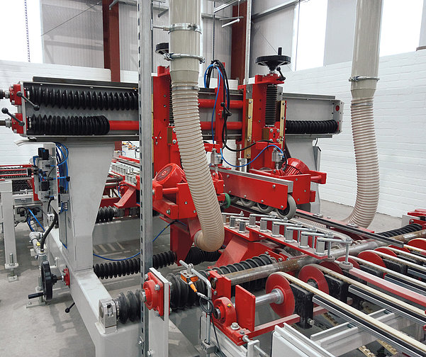 SR SCHINDLER chamfering machine with guides and extraction hoses for edge finishing of concrete products.