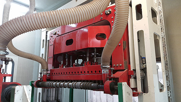 SR SCHINDLER bushhammering machine with extraction hoses for antique-style surface finishing of concrete products.